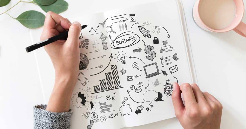 Notebook with Marketing Strategy to Boost Business